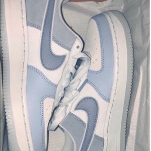 Blue and white Air Force ones